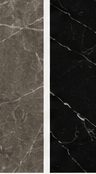 Close-up of a deep-black granite slab with fine mineral flecking, lit by soft natural light